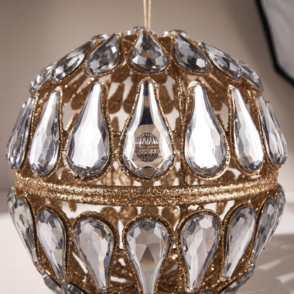 Esfera dorada con piedras espejo