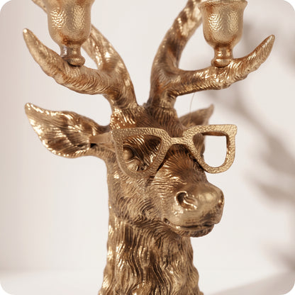 Candelabro dorado de reno con lentes