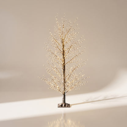 Árbol negro de micropuntos modelado de luz calida